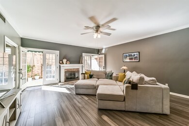 The spacious and open-concept living area is flood