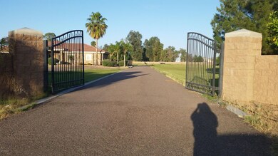 Gates to lot from Val Vista