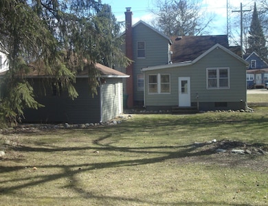 back of house with garage