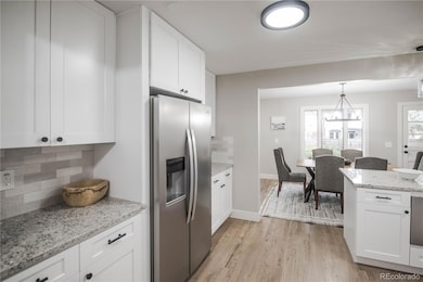 9007 E Floyd Place, Denver, CO 80231 - photo 3