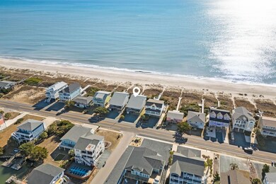 Aerial view featuring a view of the beach and a wa