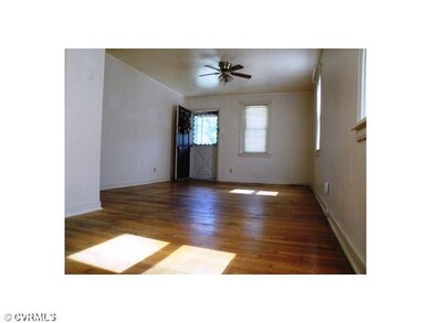 Living Room - Wood floors and a ceiling fan make y
