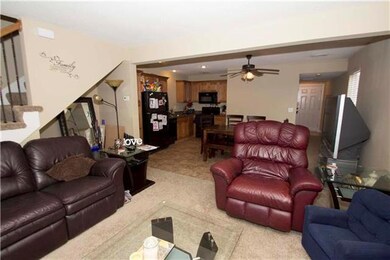 Open to the living room is the fully-equipped eat-