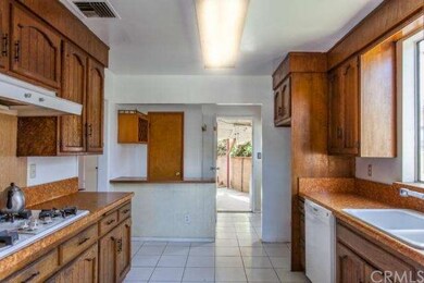Kitchen w/ a view of the laundry room