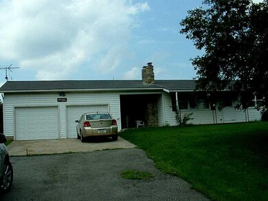 Exterior Front. Two Car Garage with cover Breezewa