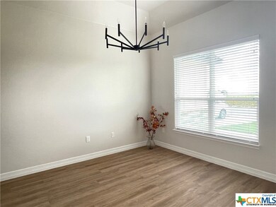 Lots of natural light illuminates the formal dinin