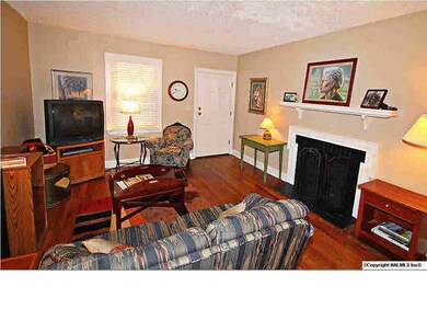 ENTER INTO THE LIVING ROOM WITH FIREPLACE