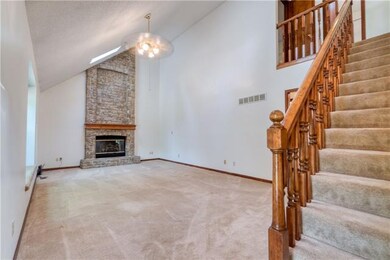 Large great room with vaulted ceilings, two skylig