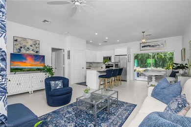 View of living room, dining room and kitchen.