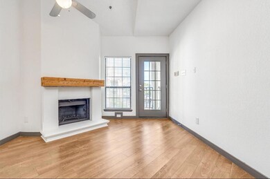 Unfurnished living room featuring ceiling fan and 