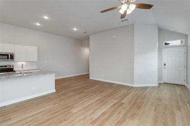 Unfurnished living room with recessed lighting, v