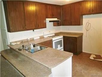 KITCHEN OPEN TO DEN HAS NEW GAS RANGE, DISHWASHER,