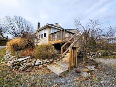 Back deck enters to porch/mudroom