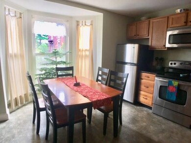 Sunny kitchen with eat-in dining.