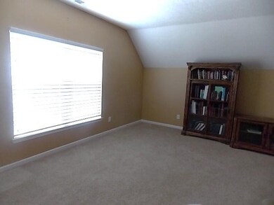 Hugh rec room with lots of storage areas. Plenty of space for the guys to enjoy their sports or play area.