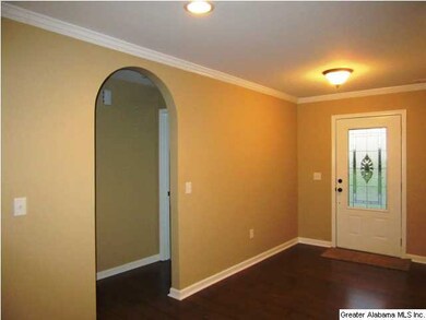 Foyer with arched doorways to the two bedrooms