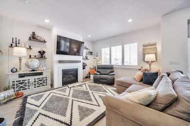 Living area with fireplace, and recessed lighting