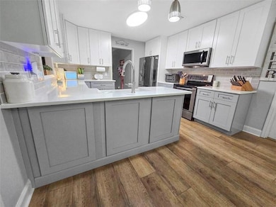 Kitchen featuring sink, stainless steel appliances