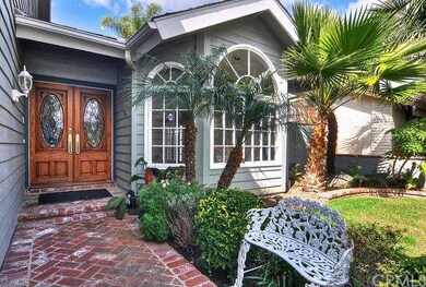 Beautiful Wood and Oval Leaded Glass Doors set the
