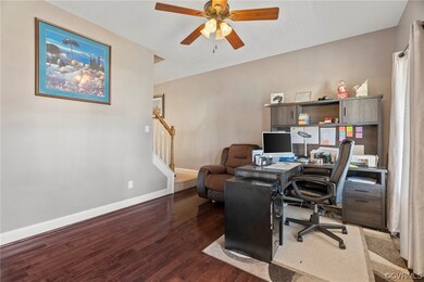 Home office featuring ceiling fan and hardwood / w
