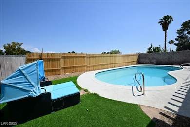 View of pool with a fenced backyard