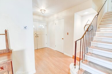 Entry with laminate floors and fresh paint
