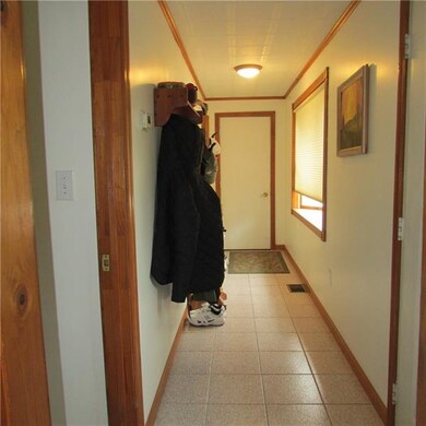 Entry to home from garage or front door. Bay windo