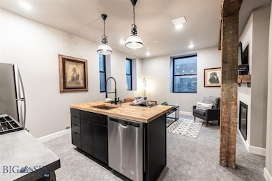 Kitchen with stainless steel appliances, sink, a k