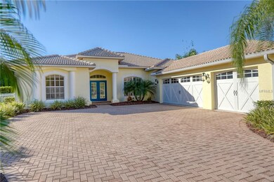 3 car garage with new doors and brick paver drive