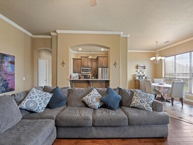 Tiled living room with a chandelier and ornamental