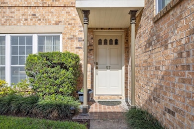 A classic covered entry welcomes you to Unit 57, f