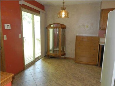 SPACIOUS EATING AREA IN THE KITCHEN! NEW PATIO DOO