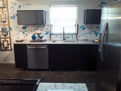 MODERN KITCHEN WITH STAINLESS STEEL AND ESPRESSO C