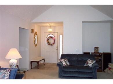 Foyer Tile floor entryway with closet