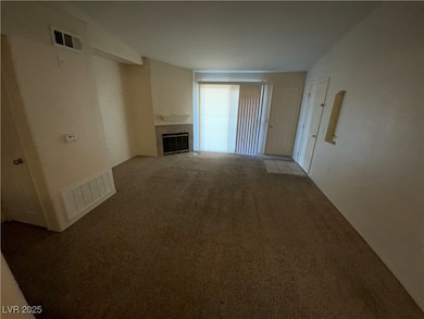 Unfurnished living room featuring carpet floors an