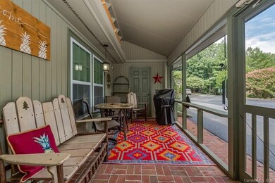 Screened porch has lots of seating area and a stor