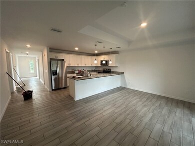 Kitchen featuring stainless steel appliances, whit
