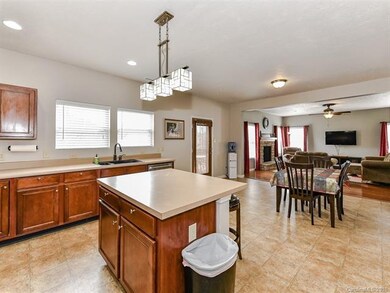 Eat in kitchen, plus an island with room for bar s