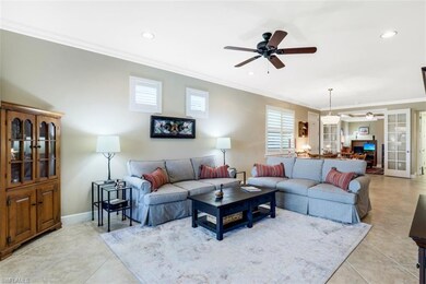 Open living area.  Tile floors and crown molding t