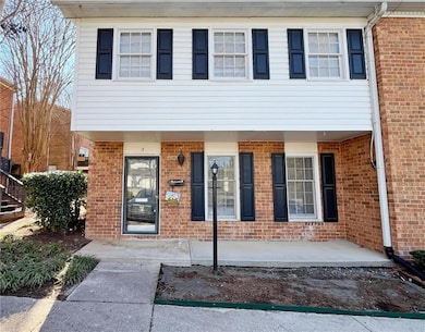 View of front of house with a patio