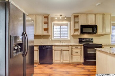 This Kitchen is a chef's delight with the large island and loads of cabinets and counter-top space