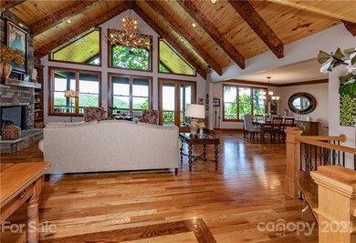 The soaring tongue & groove ceilings & hardwoods c