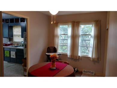 Cozy dining room is easily reverted back to 3rd be