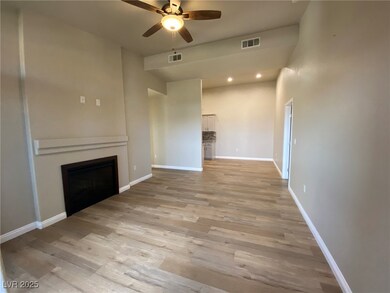 Unfurnished living room with ceiling fan, a firepl