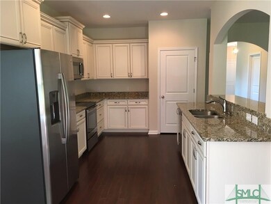 Kitchen with large island overlooking family room.