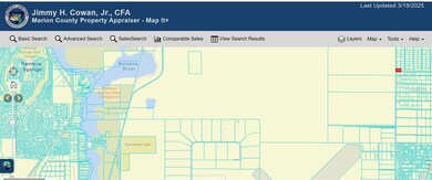 ZOOMED OUT COUNTY AERIAL. RED SQUARE IS LOT