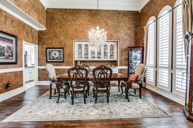 Grand formal dining room soaring ceilings with a custom butler's pantry with marble top and unique crown molding