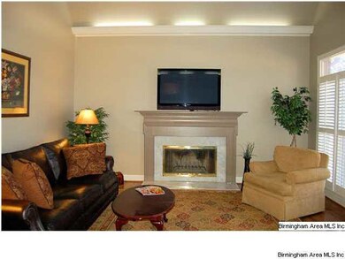 A beautiful gas fireplace is the focal point of th