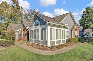 View of home's exterior featuring a yard and a sun
