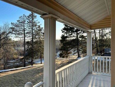 Wooden terrace featuring covered porch